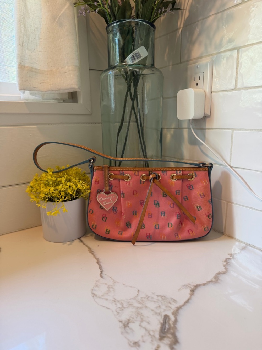 Dooney & Bourke pink monogram shoulder bag.